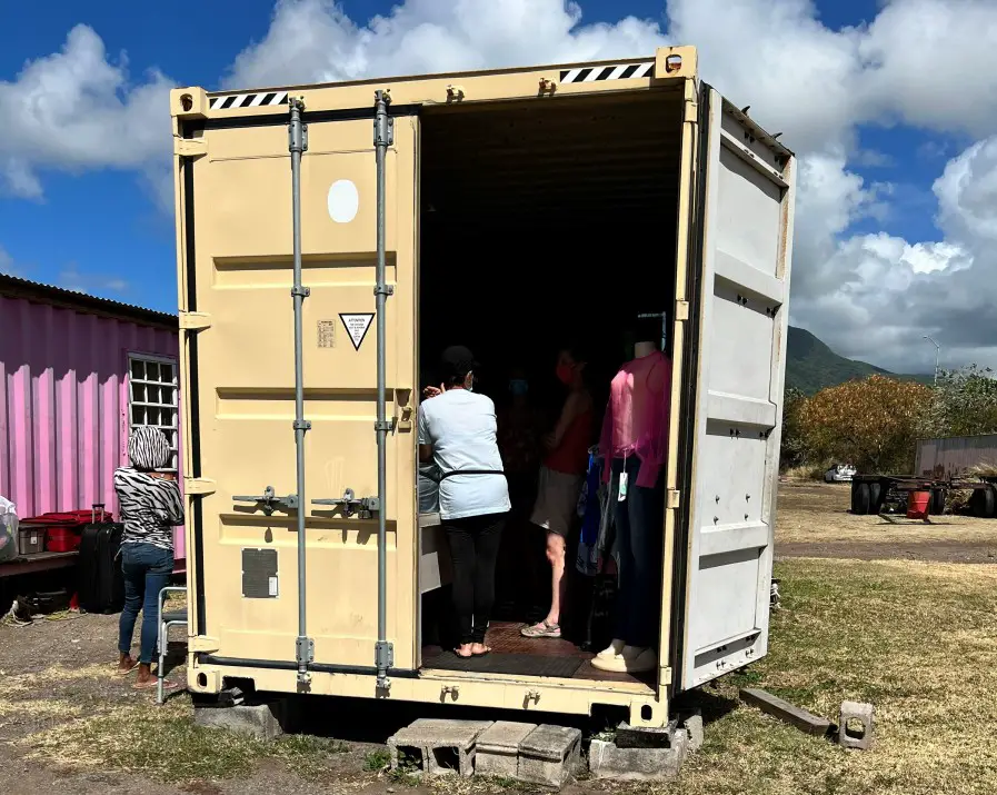 people shopping in a cream shipping container at Hidden Treasures in St Kitts