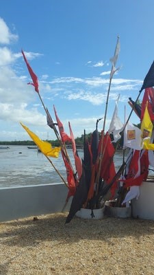large bundle of Flags at Temple in the Sea Trinidad
