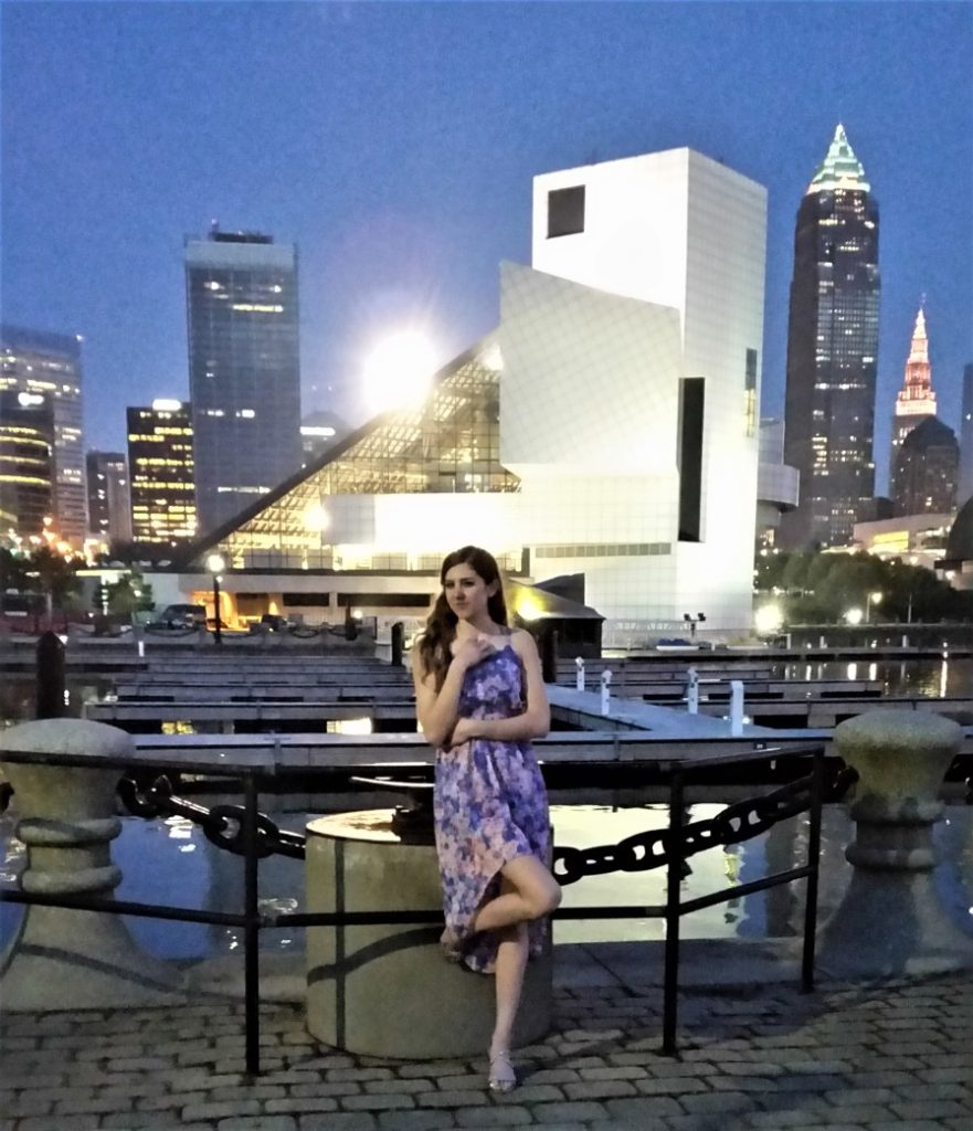 girl Posing in front of the Rock and Roll Hall of Fame