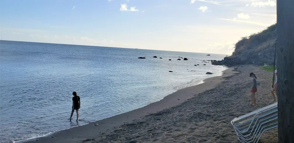 silhouette figure in the water at Sea Glass Beach in St Kitts