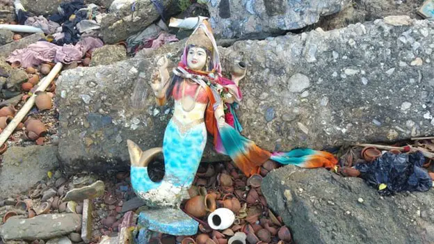 mermaid religious diety statue at Temple of the Sea Trinidad
