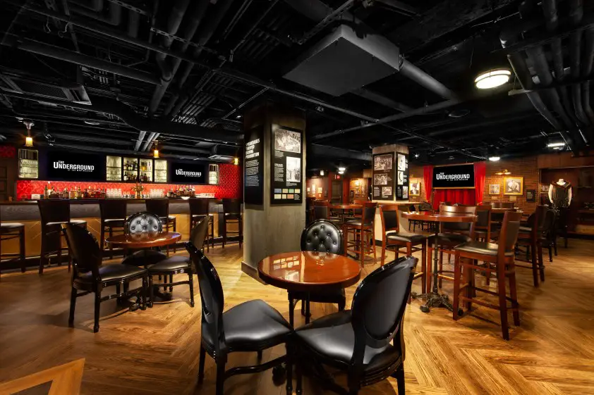 tables chairs and a bar at The Underground hidden speakeasy in downtown Las Vegas