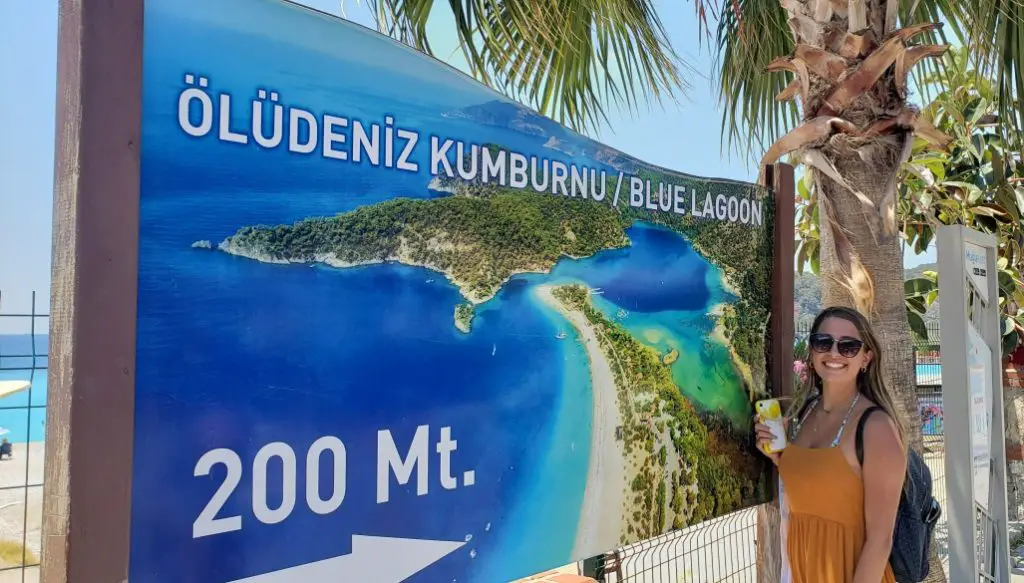 girls standing next to the map of the Blue Lagoon at Oludeniz Beach Fethiye Turkey