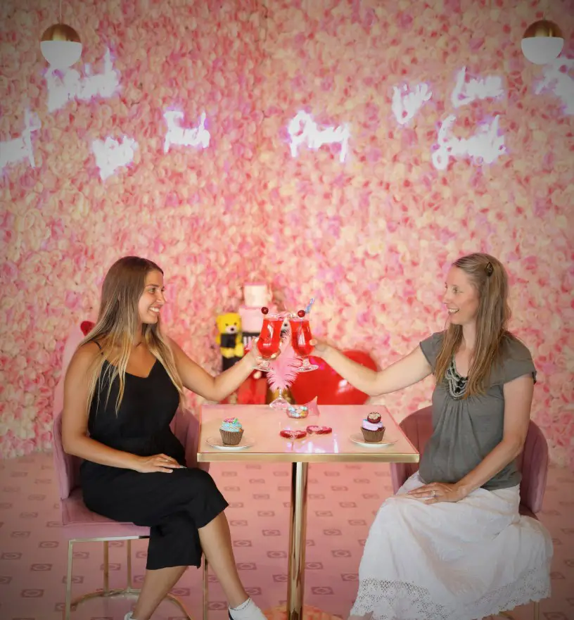 two ladies toasting at a Pink Candy Backdrop at the photoshoot on the rooftop in Istanbul