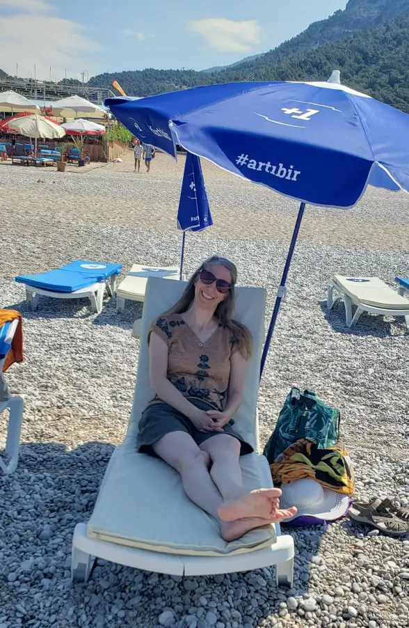 lady in a beach chair Relaxing on Oludeniz Beach in Fethiye