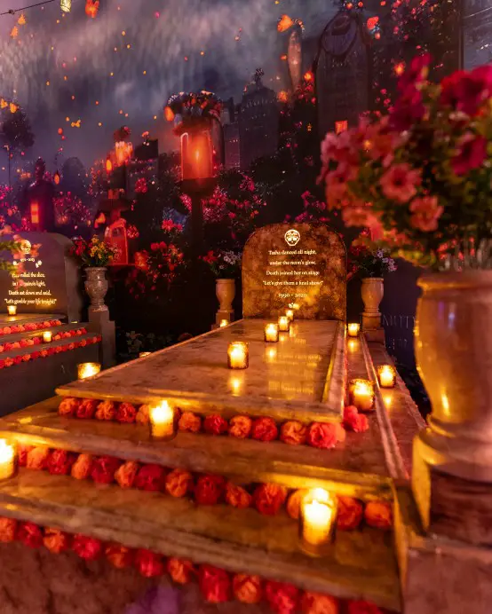 candles lit around a ceremonial grave site