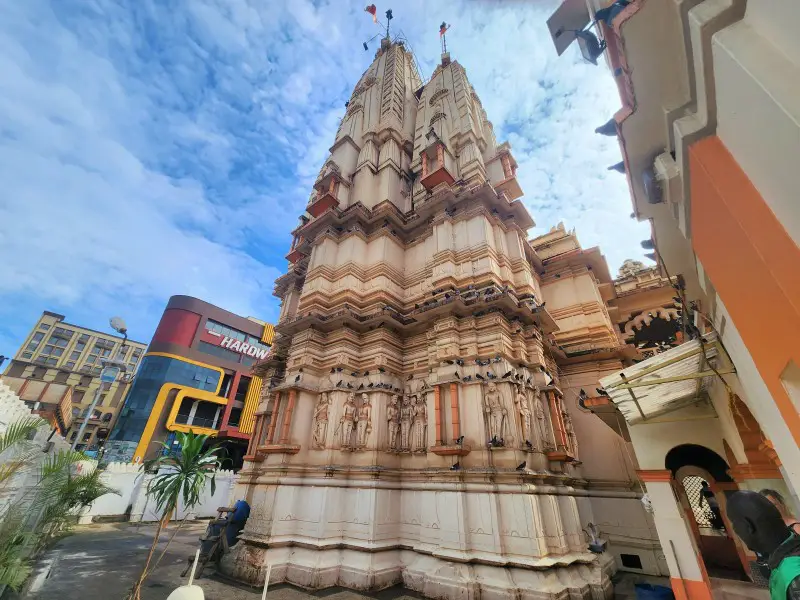 large colorful towers above the city streets of Kampala of a hindu temple