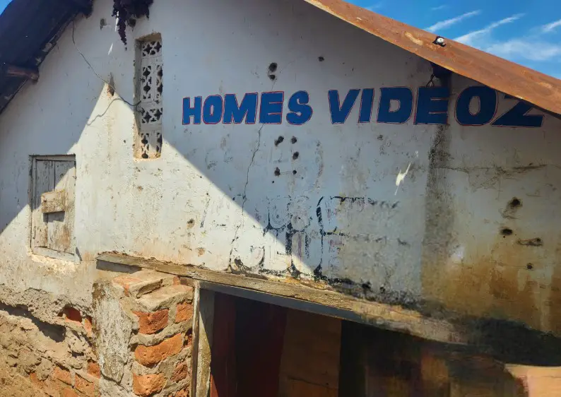 old building that serves as movie theater in kampala slum
