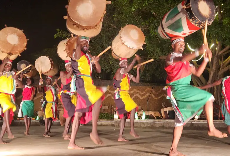 dancers with drums on their heads at Ndere Center in Kampala for a dinner showin the city