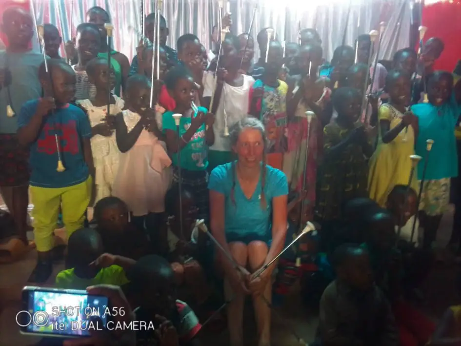 room of kids with batons at a twirling class at an orphanage in Kampala Uganda