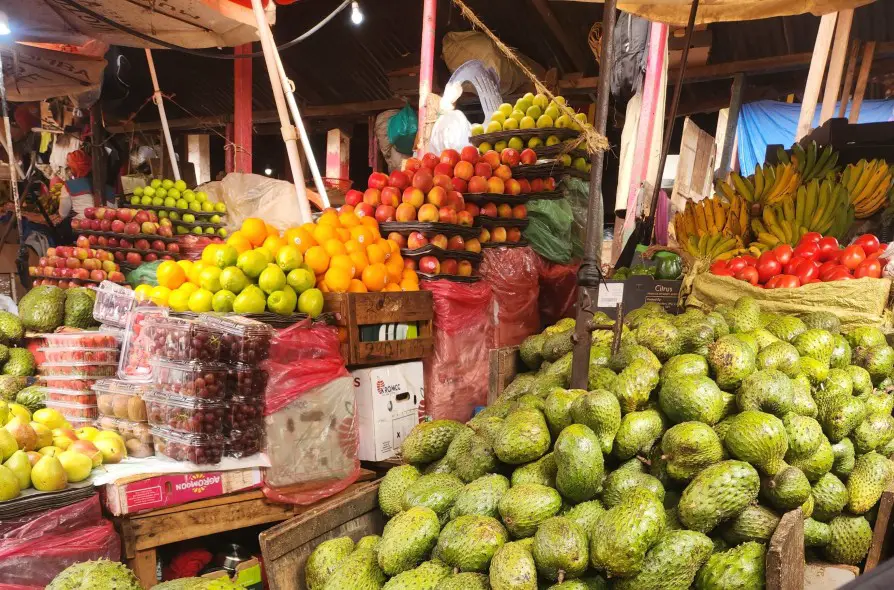 colorful fruits in piles at the market in Kampala on a city tour