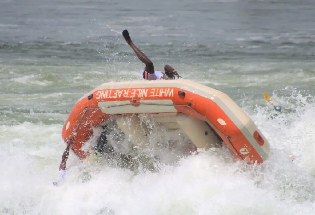 legs sticking up from the up-side-down river raft on the nile in Uganda