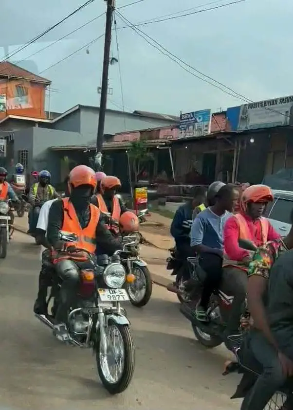 a lot of boda drivers in the crowded street