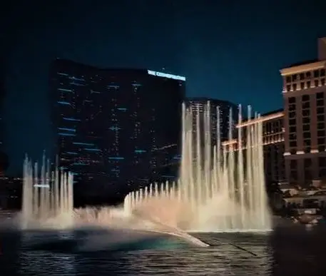 romantic water show with water spraying up high in front of Bellagio resort in Las Vegas