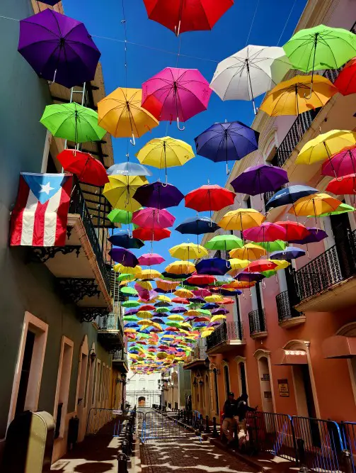 colorful umbrellas across a street in Puerto Rico inviting great instagram selfies