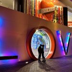 shadow of couple kissing in neon LOVE letters in Las Vegas
