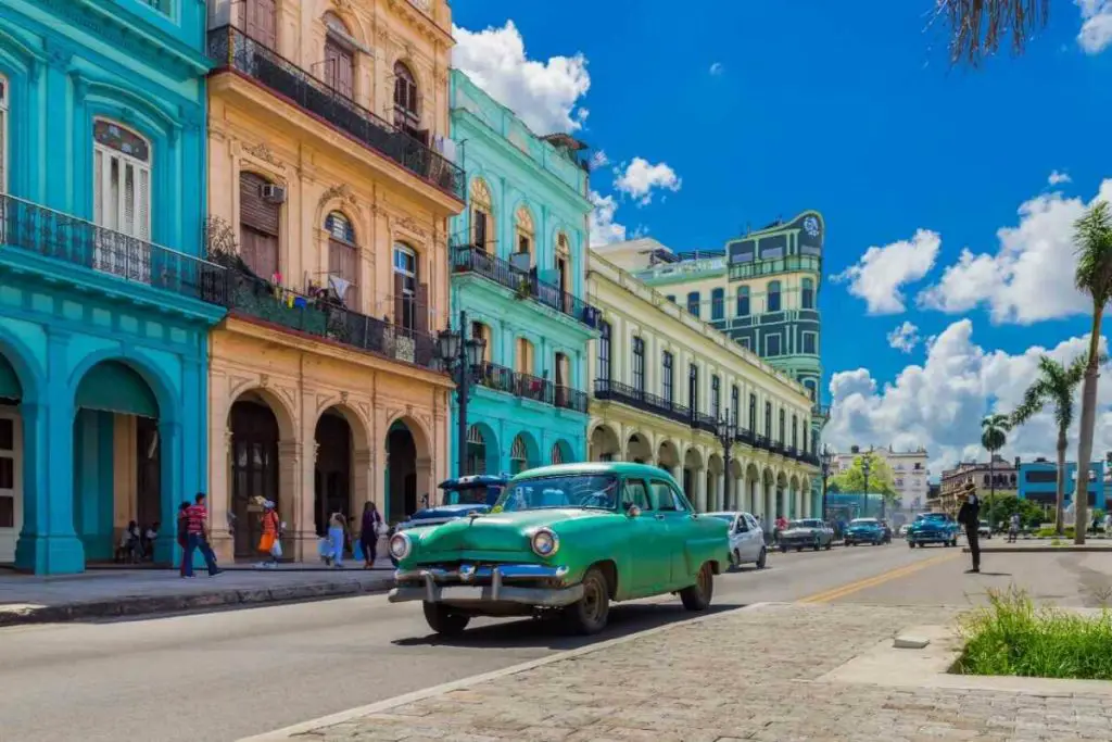 old nostalgic car on the road in Cuba during a bucket list vacation