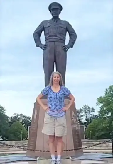 Eisenhower statue with lady standing in front with the same pose