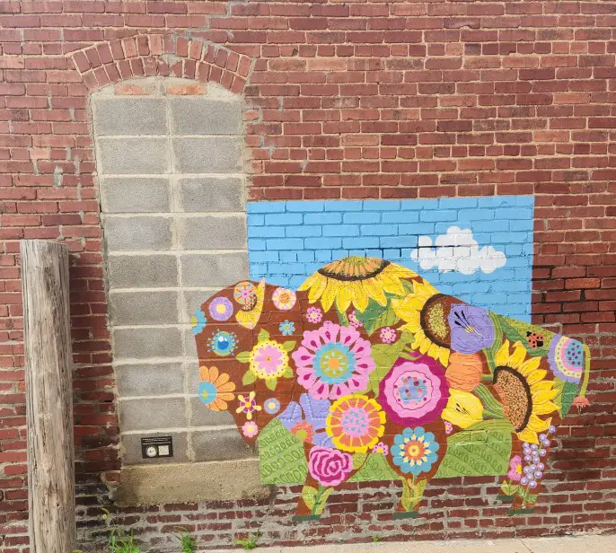 colorful buffalo painted on a brick wall in abilene kansas