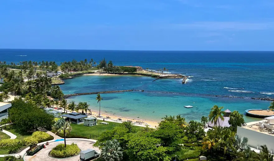 view from a distance of a beach and diving area at Escambron Beach Marine Park in Puerto Rico