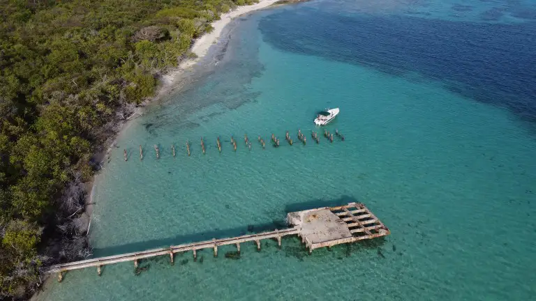 aerial view of a pier with boats in the water and one of the Great Places to scuba dive in Puerto Rico