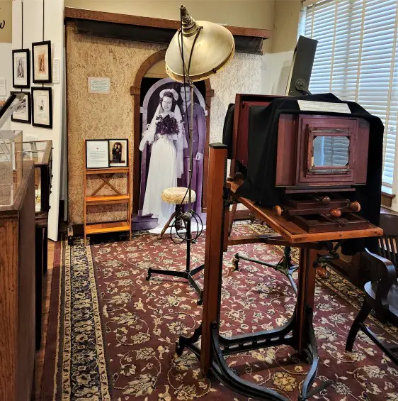 old camera set up in front of cardboard figures of the Eisenhowers at the Jeffcoat Museum in Abilene