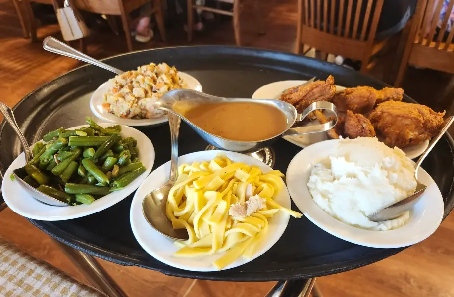 bowls and dishes of homestyle amish food on a large tray at the Blue Gate Restaurant in Shipshewana