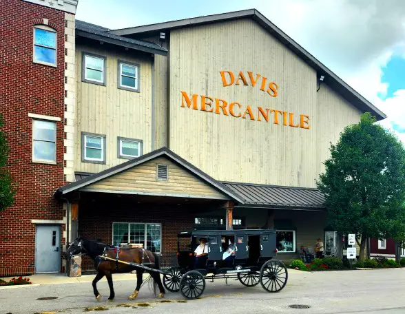 Old Building called Davis Mercantile with an Amish buggy and a horse in front of it in Shipshewana
