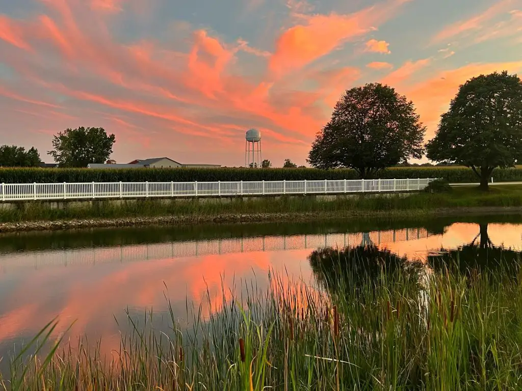 orange sunset over a small pond in Shipshewana