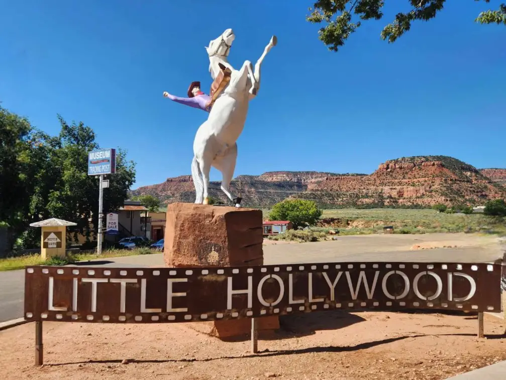 Little Hollywood Sign with horse and rider in the background in Kanab