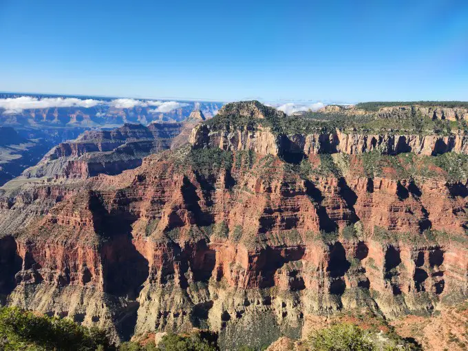 large, deep canyon with clouds in the background among the peaks of the mountains of the Grand Canyon