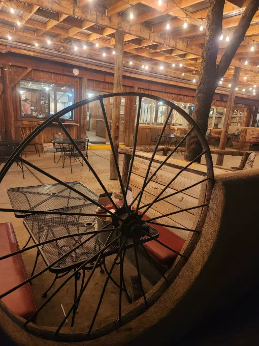 wagon wheel with dinner tables behind it