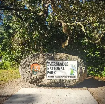 sign on a rock that says Everglades National Park