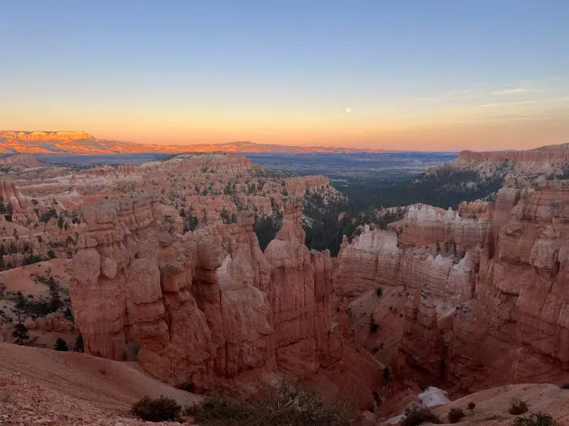 red canyons with a sunset in the background