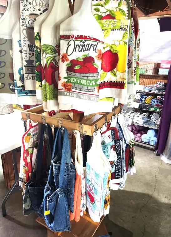 clothing rack of handmade purses and towels in Amish country in Indiana