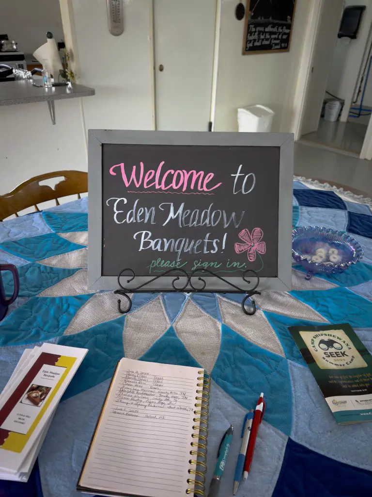 chalkboard welcome sign on a dinner table in an Amish home