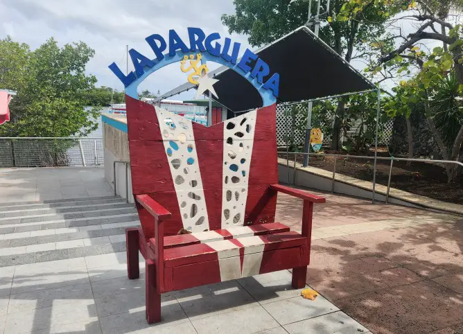 red white and blue chair decorated in the form of the Puerto Rico flag on the boardwalk