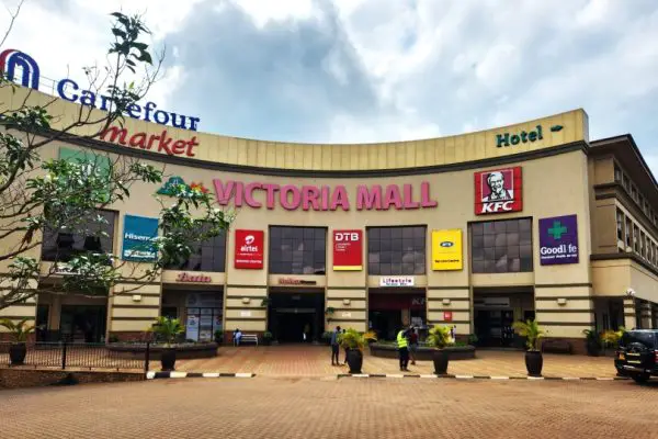 large building with sign Victoria Mall in Uganda
