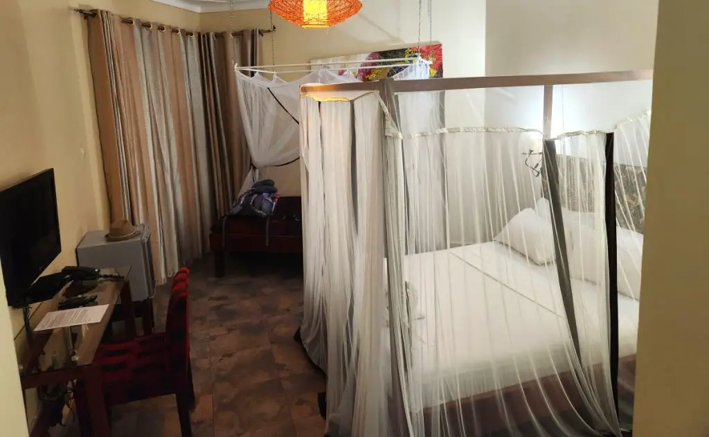 beds with mosquito netting at two friends hotel in entebbe uganda