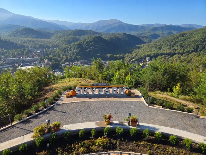 Skypark Gatlinburg Sign from far away surrounded by mountains
