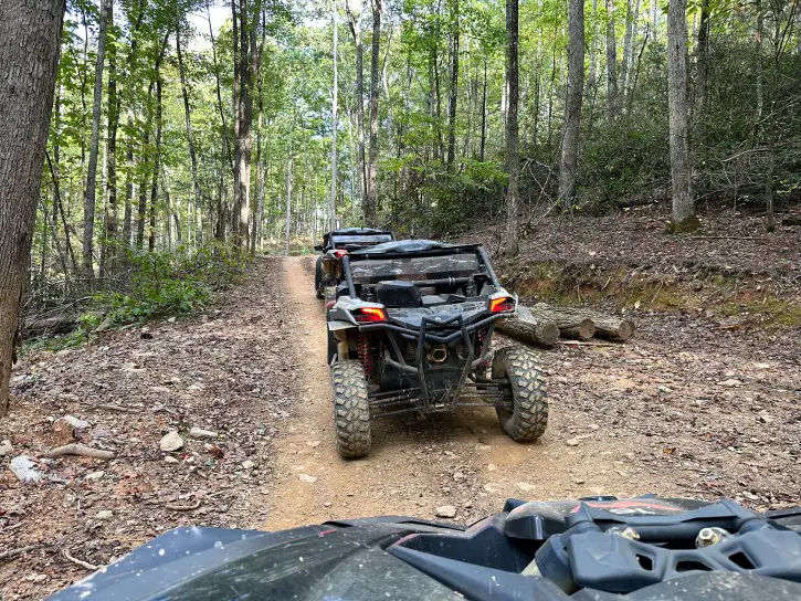 looking out of the drivers seat of a vehicle at a UTV driving up a mountain in Pigeon Forge TN
