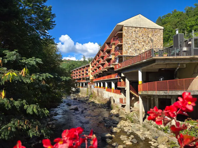 Beautiful river with a hotel along side of it in Gatlinburg TN