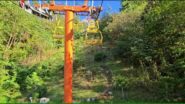 yellow cable cars on a chair lift