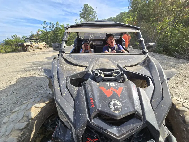 man and woman in a UTV in the mountains in Pigeon Forge TN